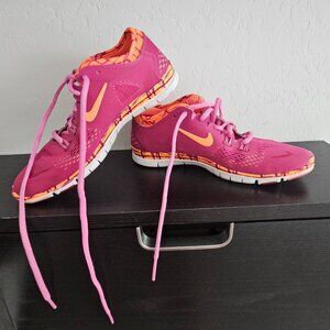 Nike Free running shoes, women's size 6, pink/orange colorway